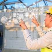 Close up engineering man hand is touching virtual reality Analytics engineering data in a field over construction background